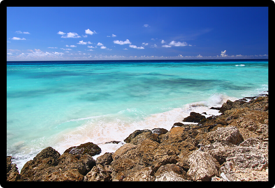 Tropical view of the Atlantic Ocean from the rocky coast of Barbados.