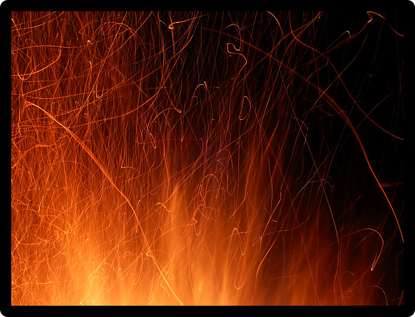 Vivid whirl of flame and sparks light up the night.