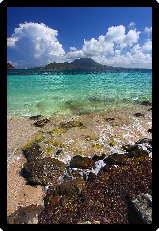 Small waves wash ashore along Majors Bay Beach on the Caribbean Island of Saint Kitts.