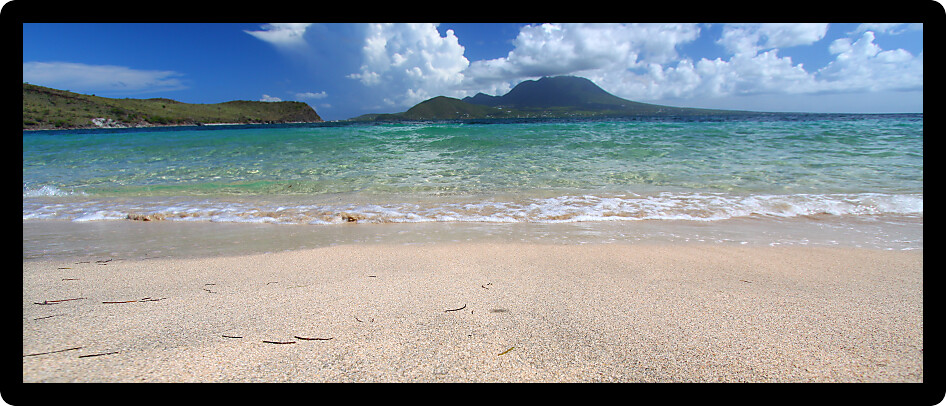 Waves wash ashore at Majors Bay Beach on the Caribbean island of Saint Kitts.