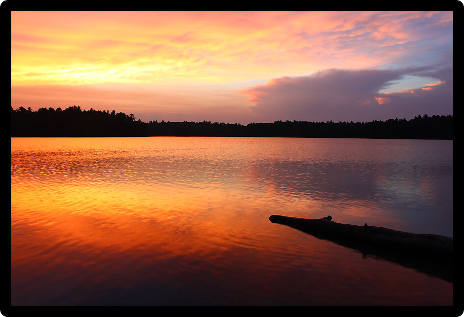 Brilliant colors of sunset over a northwoods Wisconsin Lake.
