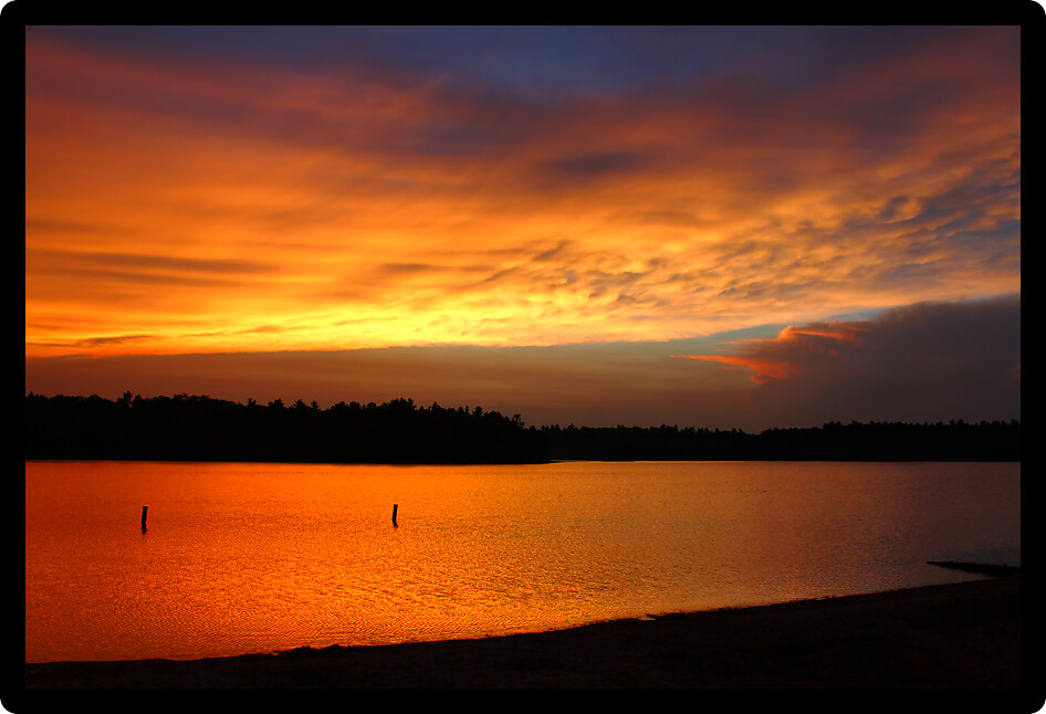 Brilliant colors of sunset over a northwoods Wisconsin Lake.