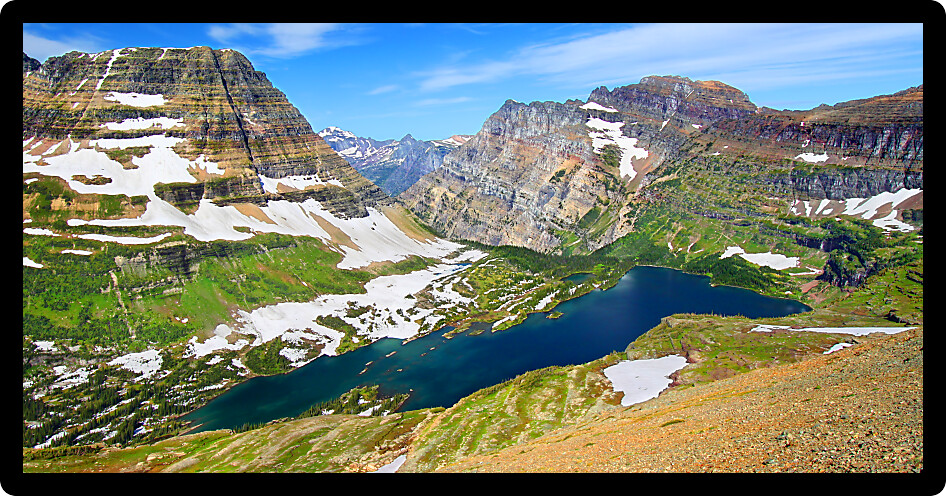 Hidden Lake and alpine scenery of Glacier National Park seen from elevation.