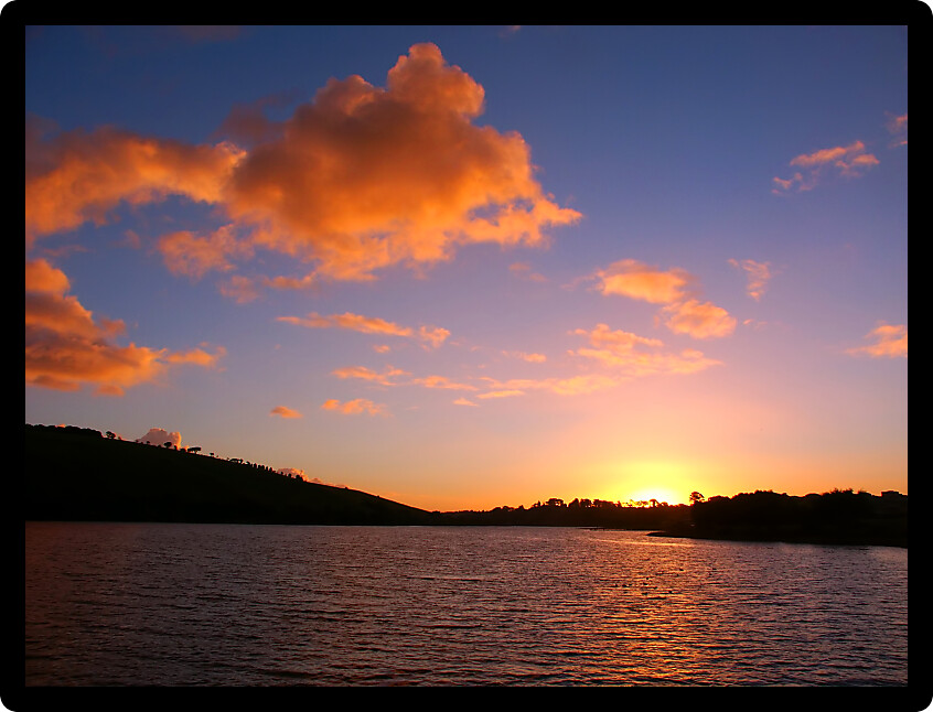 Sunset over small waves on the Hopkins River near Warrnambool of Victoria Australia.
