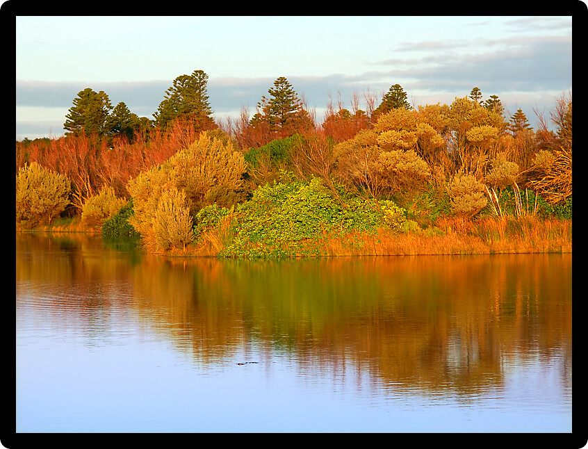 Beautiful blue skies reflect off Lake Pertobe in the town of Warrnambool Australia.