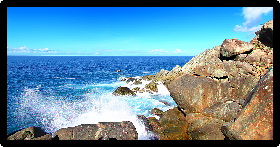 Waves crash over huge boulders at Shark Bay National Park in the British Virgin Islands.