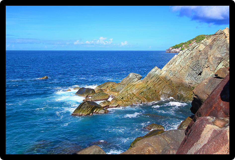 Waves crash over huge boulders at Shark Bay National Park in the British Virgin Islands.