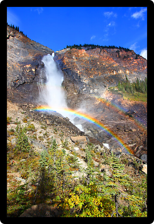 Double rainbows in the mist below Takakkaw Falls of Yoho National Park in Canada.