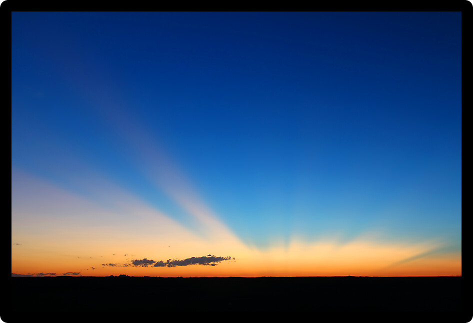 Rays of sunlight shine high over Buffalo Gap National Grassland.