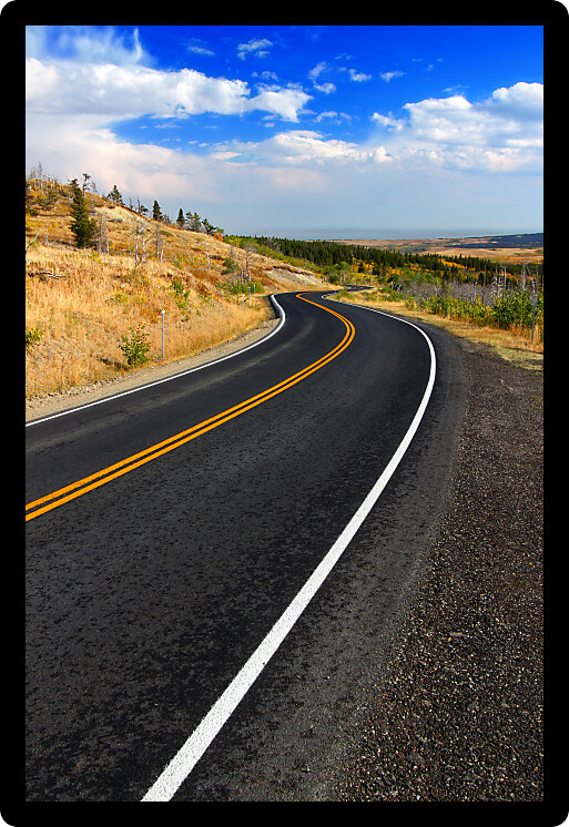 Winding road through the rural contryside of Glacier County Montana.