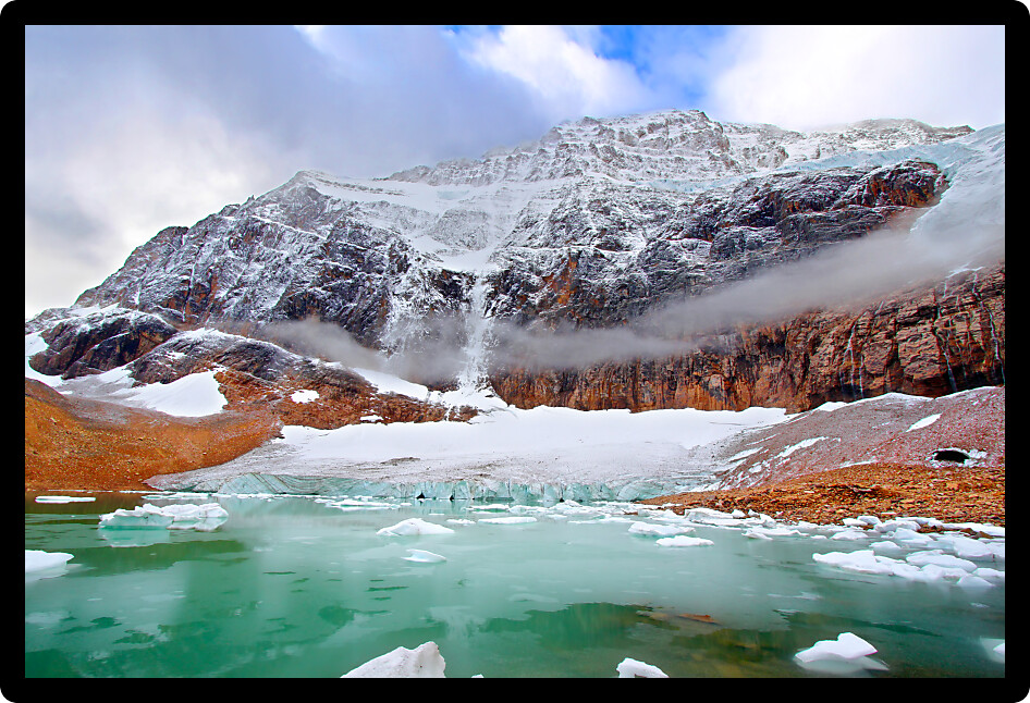 Icebergs float in glaical meltwater below Mount Edith Cavell in Jasper National Park of Canada.