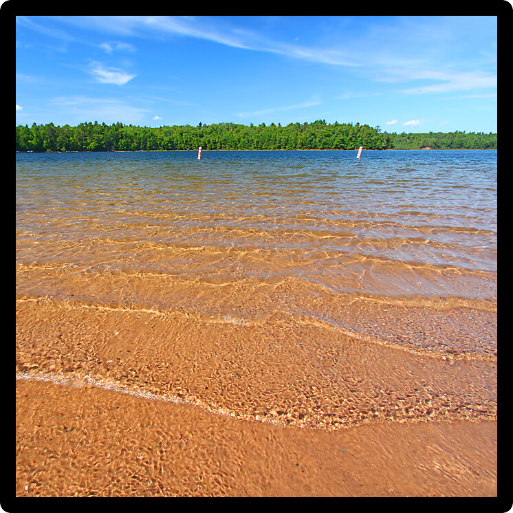 Beautiful swimming beach of a northwoods Wisconsin Lake.