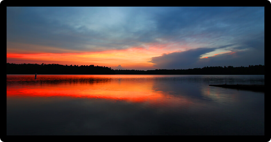 Brilliant colors of sunset over Buffalo Lake in the Northern Highland American Legion State Forest of Wisconsin.