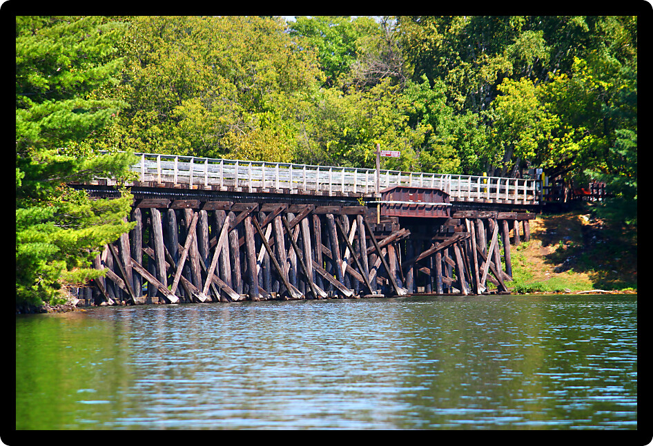 Rustic wooden trestle across the Bearskin State Trail in Minocqua Wisconsin.