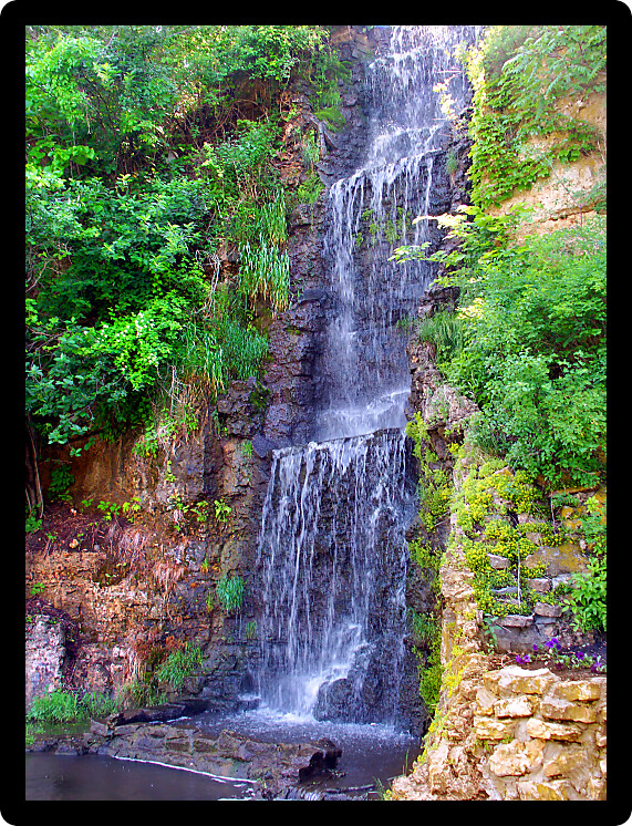 Beautiful waterfall flowing at Krape Park in northern Illinois.