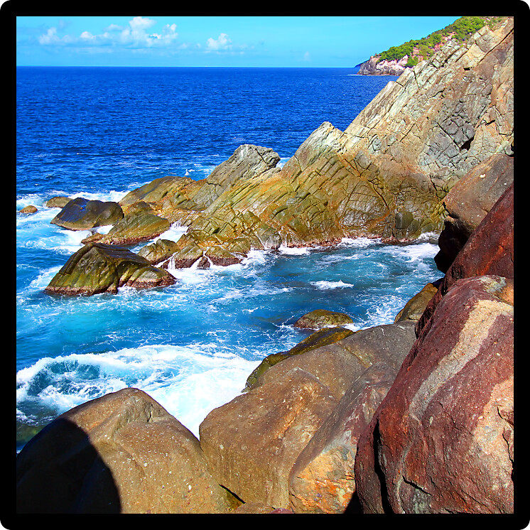 Waves crash over huge boulders at Shark Bay National Park in the British Virgin Islands.
