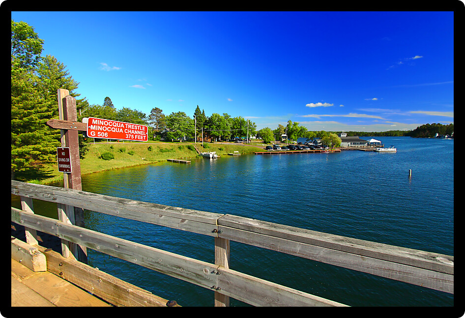 Rustic wooden trestle across the Bearskin State Trail in Minocqua Wisconsin.