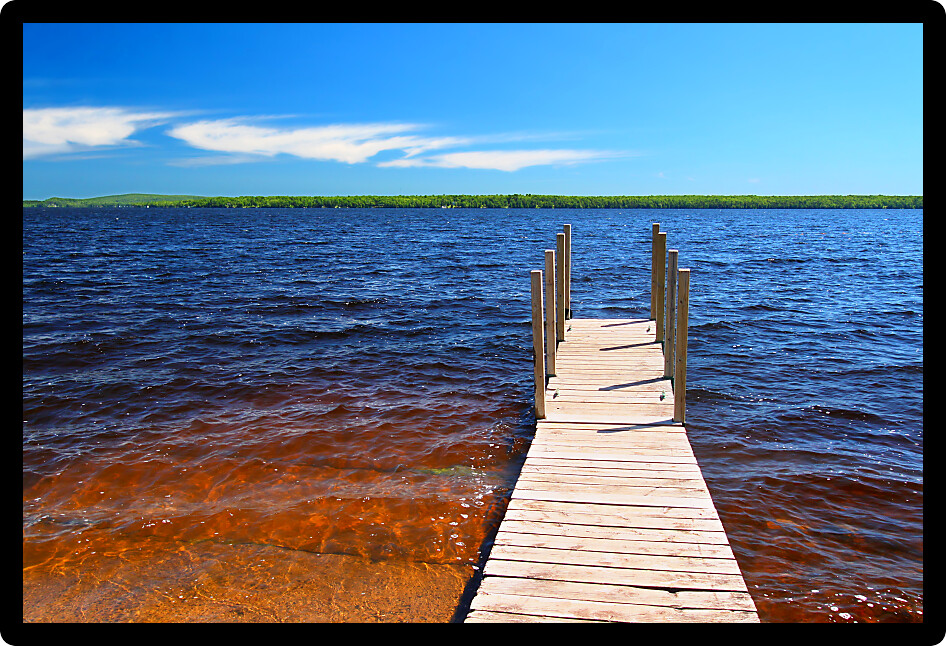 Wooden pier and choppy waters of Lake Gogebic at Ontonagon County Park Michigan.