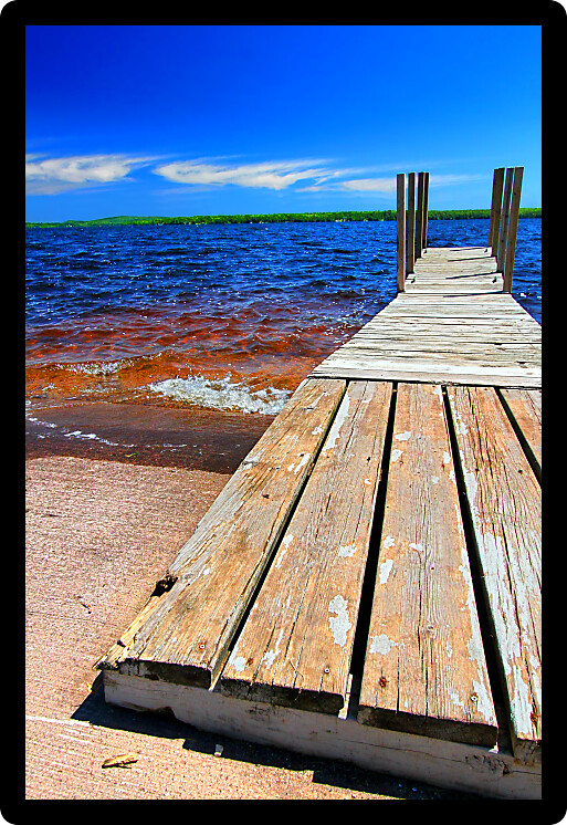 Wooden dock and choppy waters of Lake Gogebic at Ontonagon County Park Michigan.