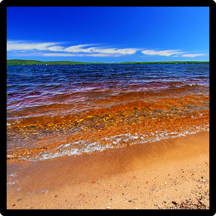 Summer beach landscape of Lake Gogebic in northwoods Michigan.