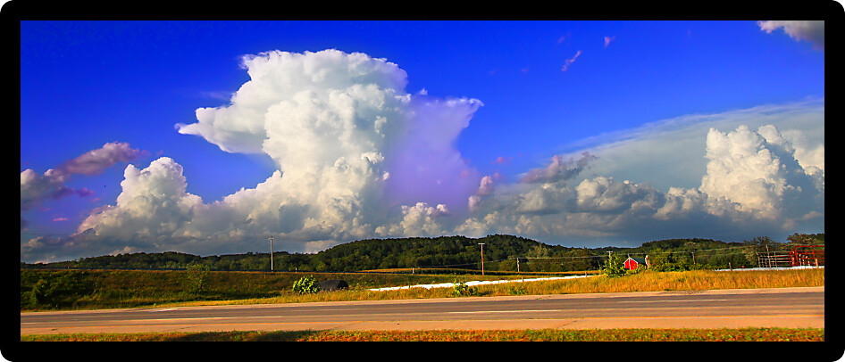 Supercell thunderstorm erupting over the farmlands of Rock County Wisconsin in the summer of 2015.