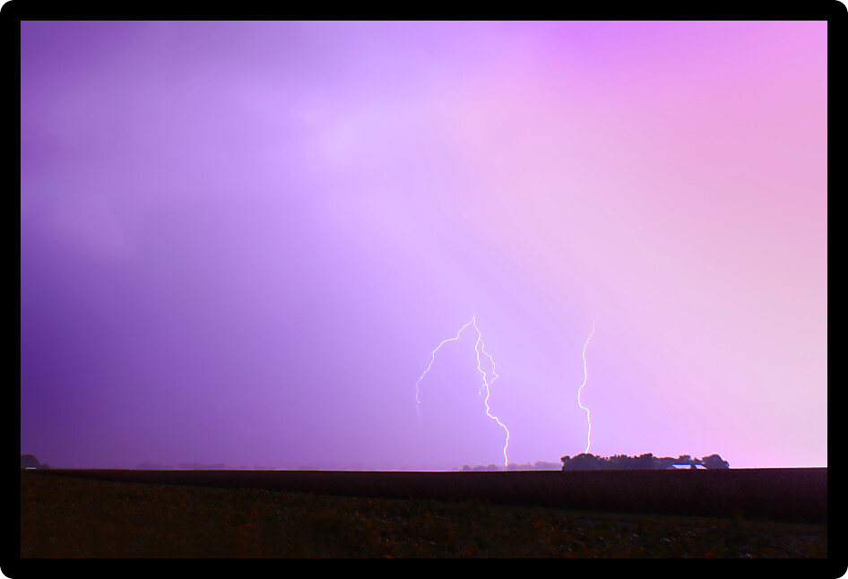 Lightning illuminates thunderstorm clouds over Champaign County in central Illinois.