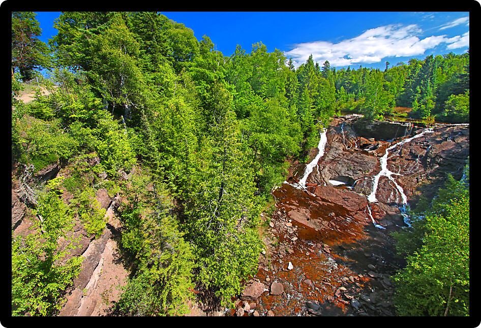 Eagle River Falls cascades down a rocky cliff in the Keweenaw Peninsula of Michigan.