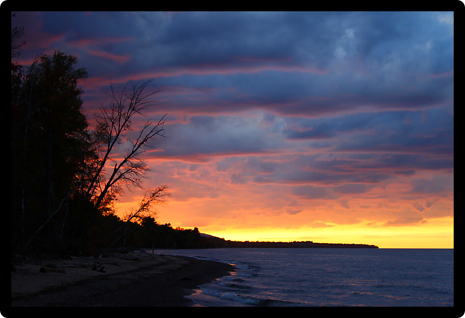 Sunset colors along the beach of Lake Superior in northern Michigan.
