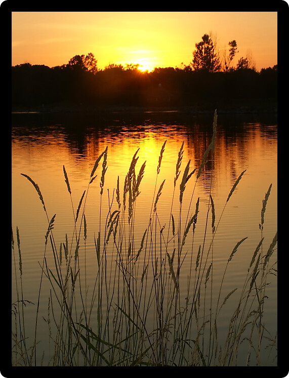Sunset over Bauman Park Lake in Cherry Valley Illinois.