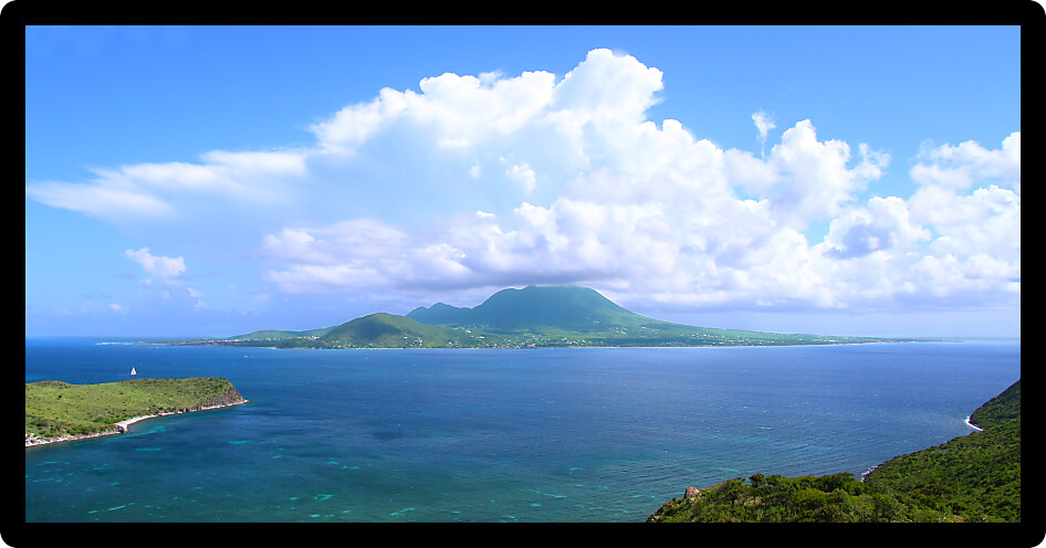 Distant view of the tropical Caribbean island Nevis from Saint Kitts.