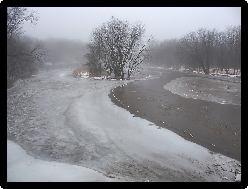 Dense fog over the icy Kishwaukee River in Illinois.