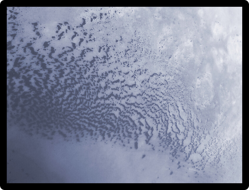 Strange patterns formed on an icy river.