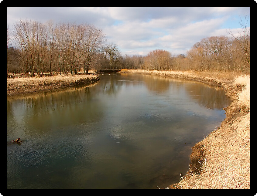 The Kishwaukee River winds through northern Illinois on a sunny autumn day.