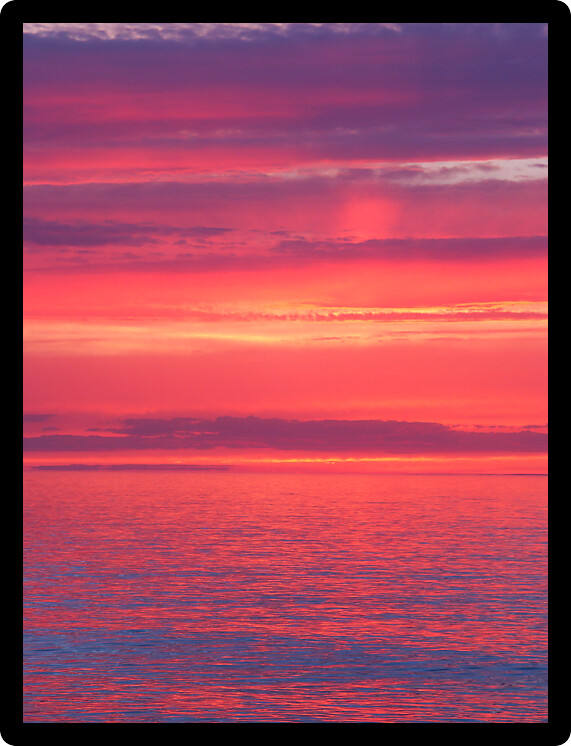 Beautiful pink colors reflect off Lake Superior in northern Michigan.