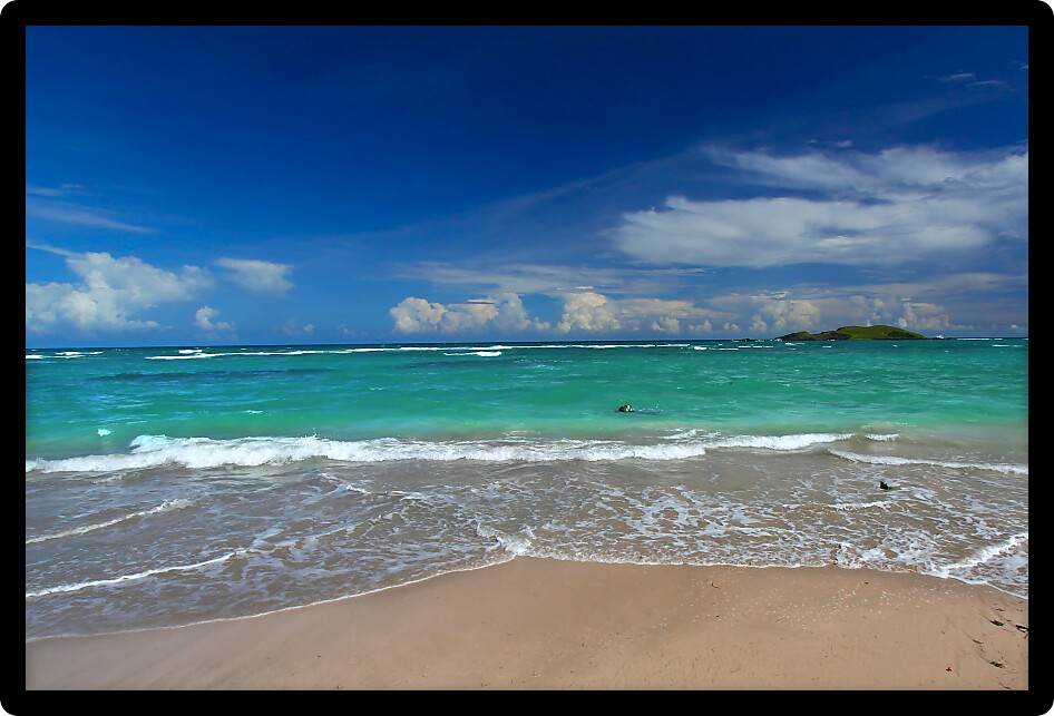 Waves wash ashore at the beach on the Caribbean island of Saint Lucia.