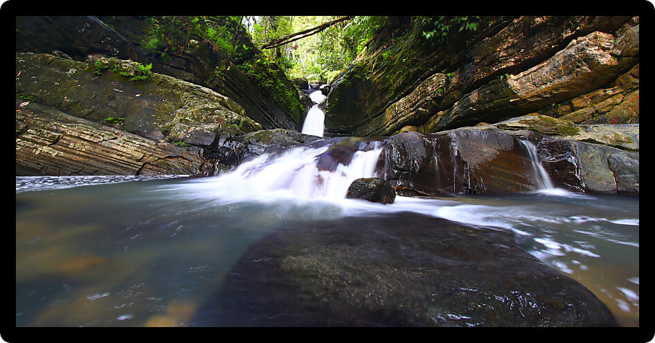 Tranquil rainforest cascade above La Mina Falls in Puerto Rico.