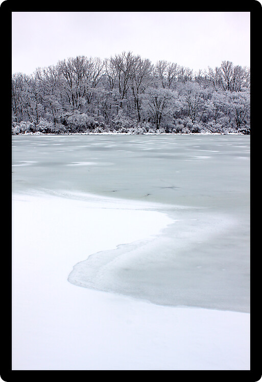 Freshly fallen snow on Pierce Lake at Rock Cut State Park in Illinois.