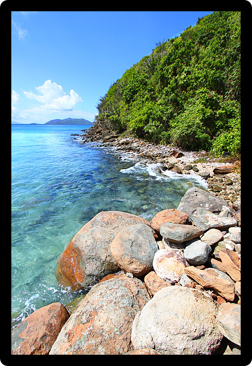 Rugged rocky coastline along beautiful Brewers Bay of Tortola BVI.