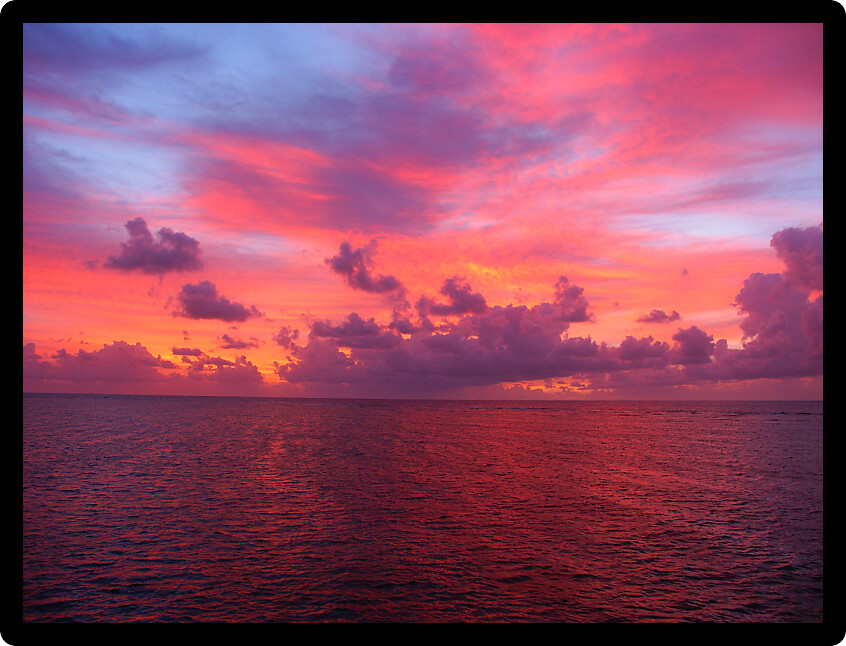 Sunset over the waters of the Pacific Ocean off Queensland Australia.
