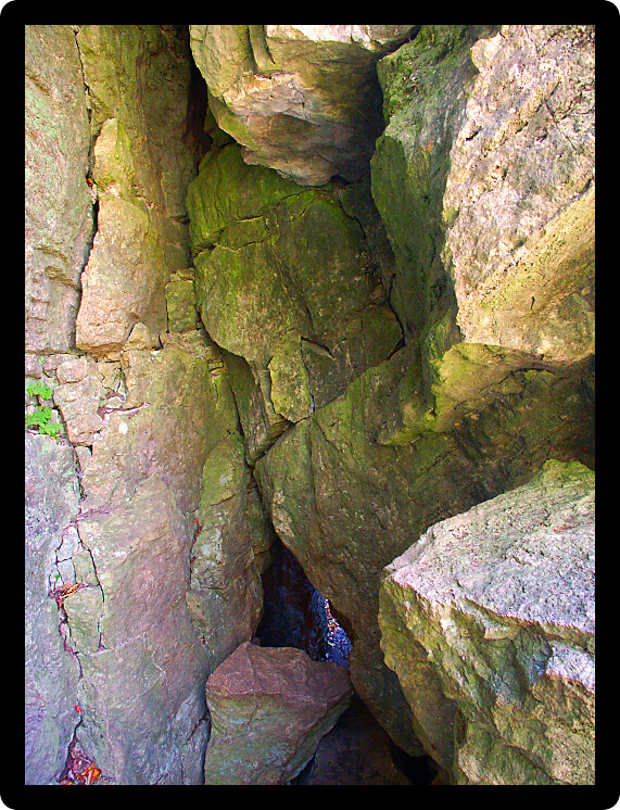 Narrow corridor through giant rocks at Maquoketa Caves in Iowa.