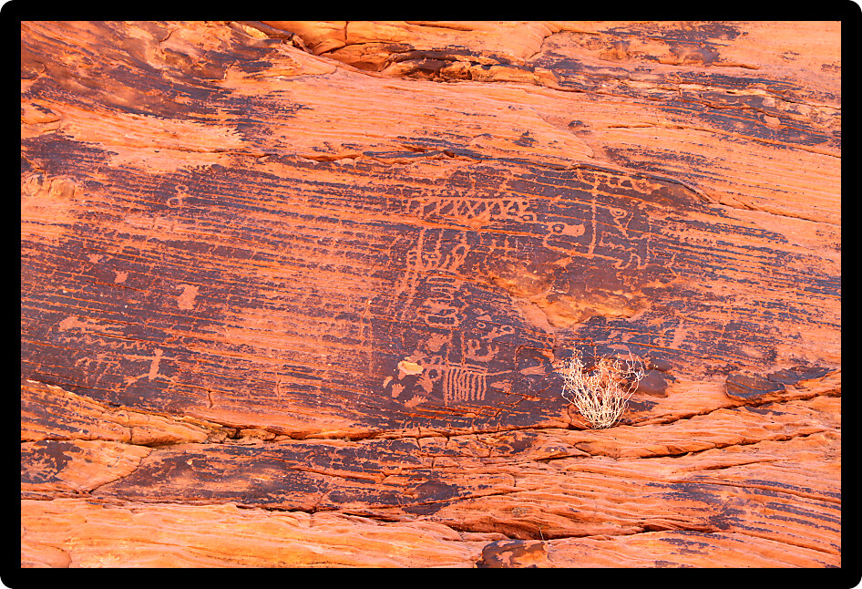 Strange petroglyphs on a rock wall at Valley of Fire State Park in Nevada.