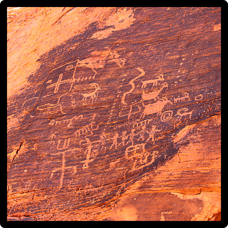 Strange petroglyphs on a rock wall at Valley of Fire State Park in Nevada.