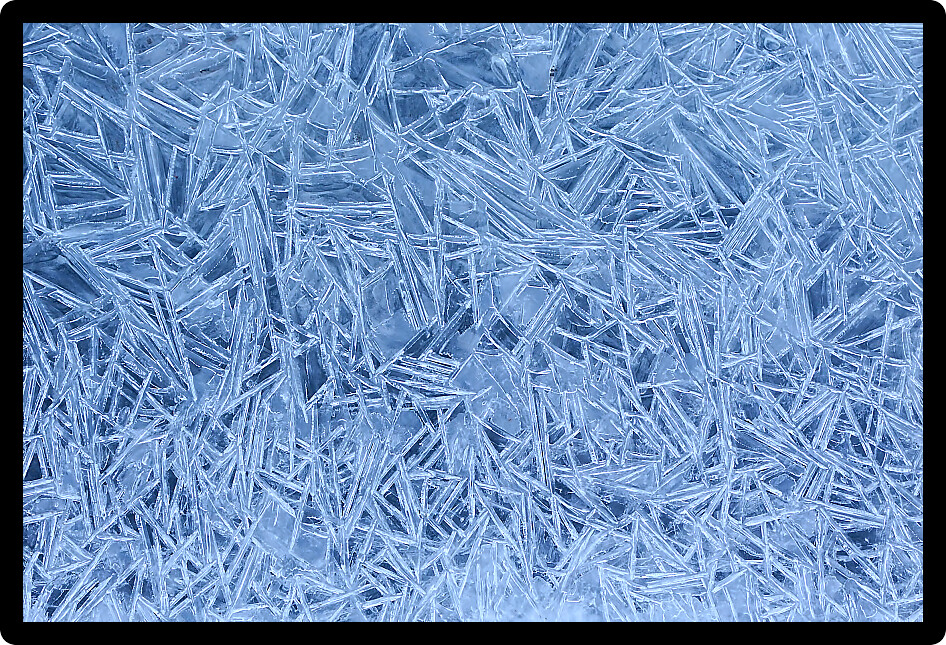 Beautiful ice patterns formed along a creek.