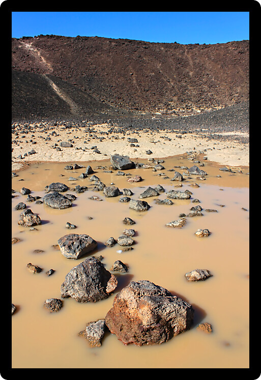 Small puddle at the bottom of Amboy Crater in the deserts of southern California.