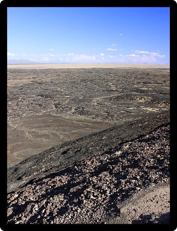 Volcanic rock scatters the desert around Amboy Crater National Natural Landmark in California.