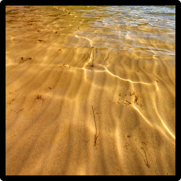 Interesting patterns in the sand seen through crystal clear Wisconsin waters.