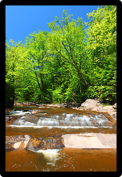Sunny day at Nonesuch Falls in the Porcupine Mountains Wilderness State Park of Michigan.