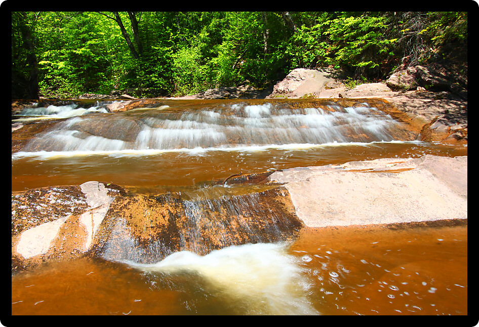 Sunny day at Nonesuch Falls in the Porcupine Mountains Wilderness State Park of Michigan.