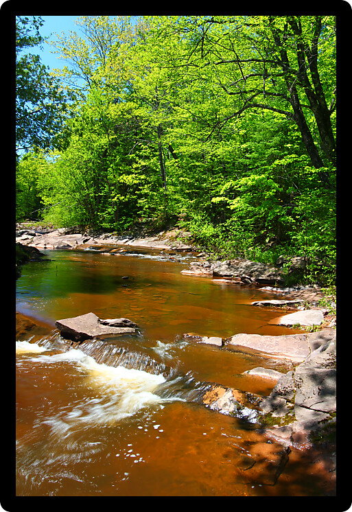 Sunny day at Nonesuch Falls in the Porcupine Mountains Wilderness State Park of Michigan.