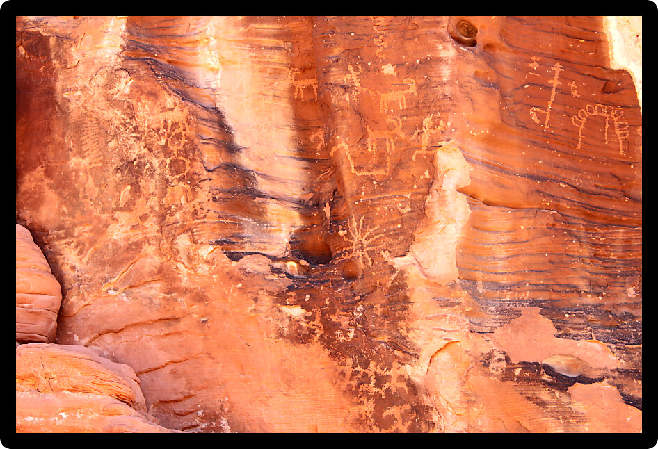 Strange petroglyphs on a rock wall at Valley of Fire State Park in Nevada.